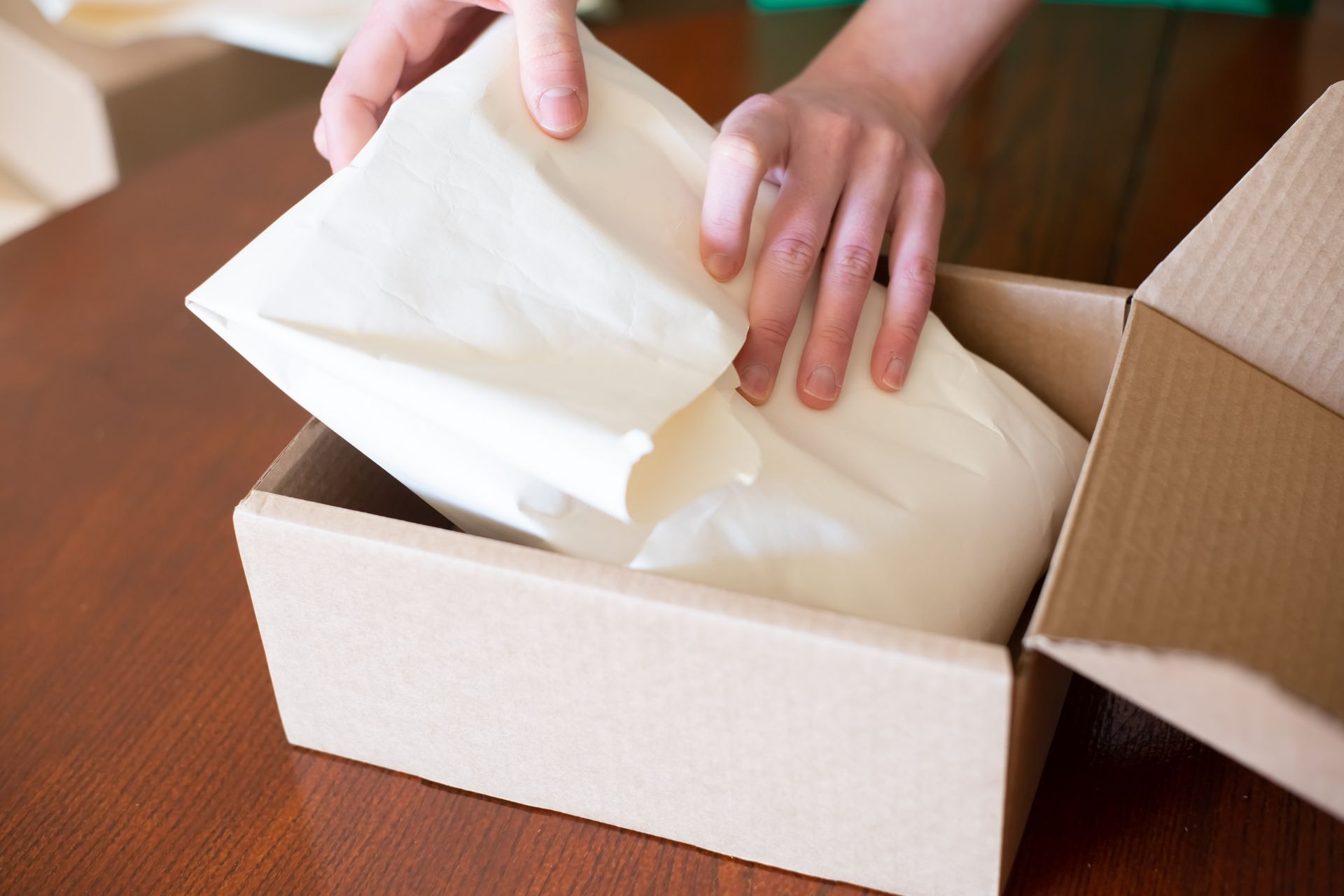 Packing an e-commerce order into a shipping box